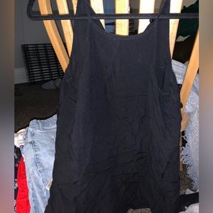 Black sleeveless blouse with button in back